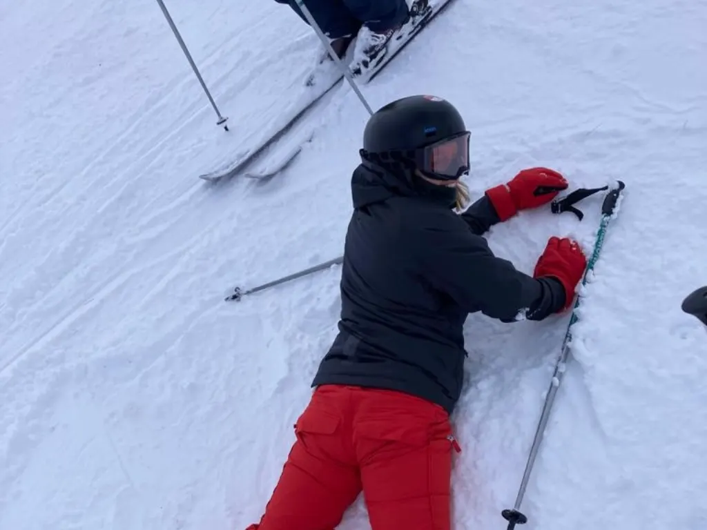 Nic face down in the snow. The smile belies the internal turmoil inside. I went skiing for the first time and it was terrifying
