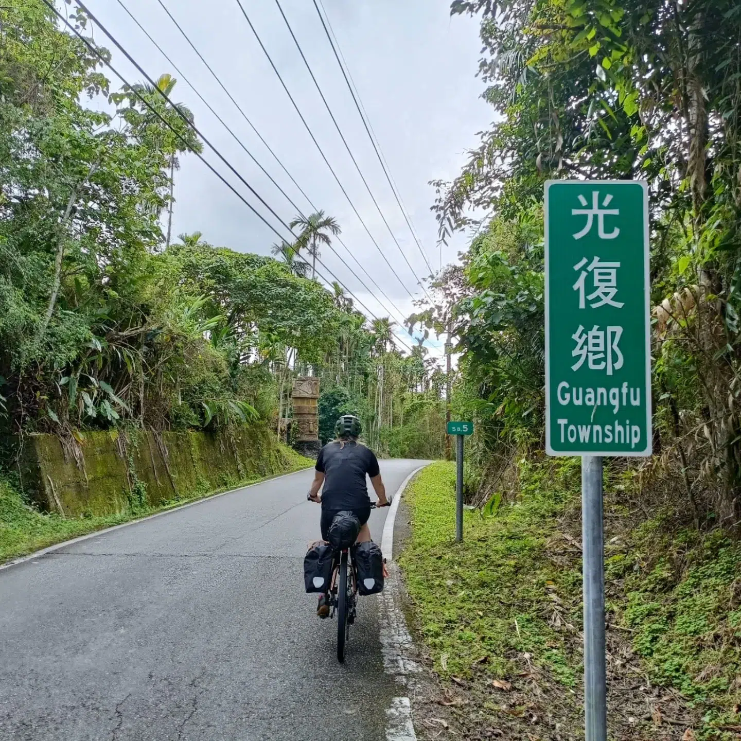 Blog cover photo, Nic riding though indigenous villages in Taiwan